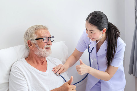 caregiver checking seniors mans health